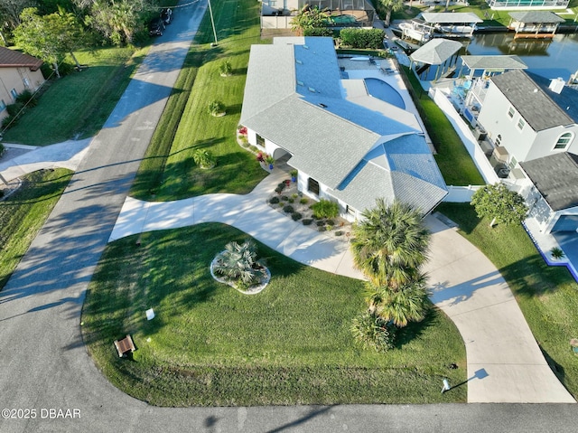 birds eye view of property with a water view