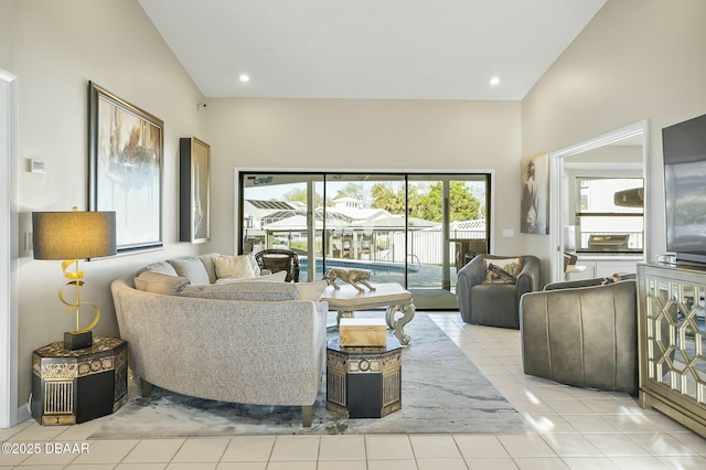 tiled living room featuring high vaulted ceiling