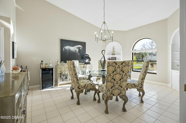 tiled dining room featuring an inviting chandelier, beverage cooler, and vaulted ceiling