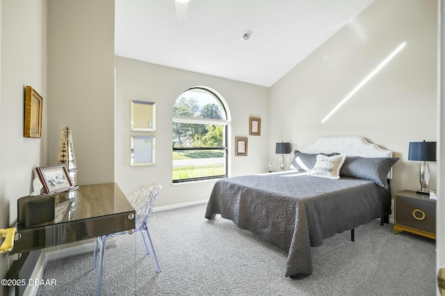 carpeted bedroom with lofted ceiling