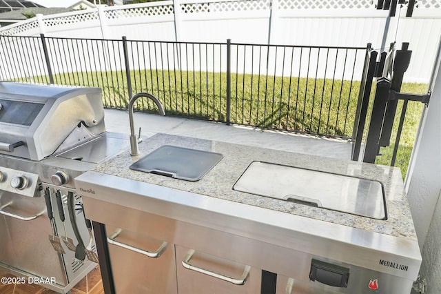 view of patio / terrace featuring exterior kitchen