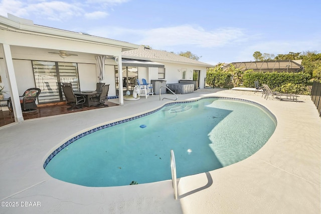 view of swimming pool featuring ceiling fan and a patio area