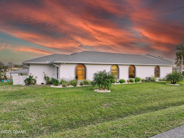 view of front of home with a yard