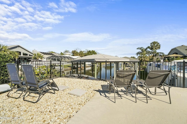 view of patio with a water view