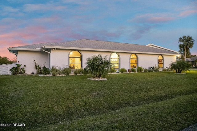 view of front of home with a yard