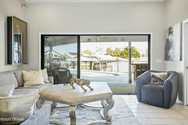 tiled living room featuring ceiling fan