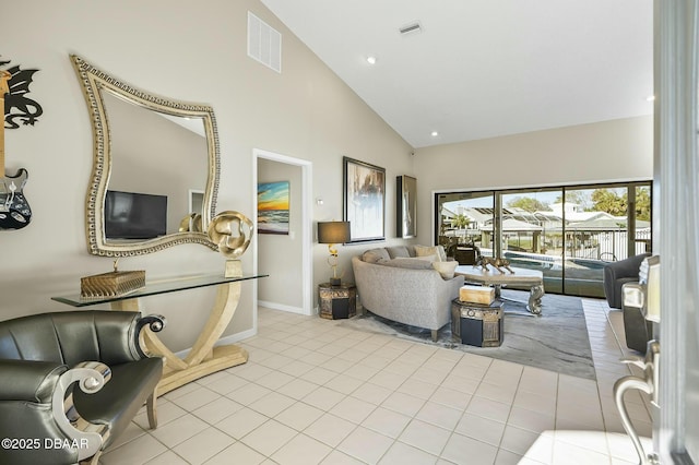 tiled living room with high vaulted ceiling