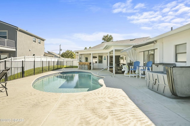 view of pool featuring a bar and a patio area