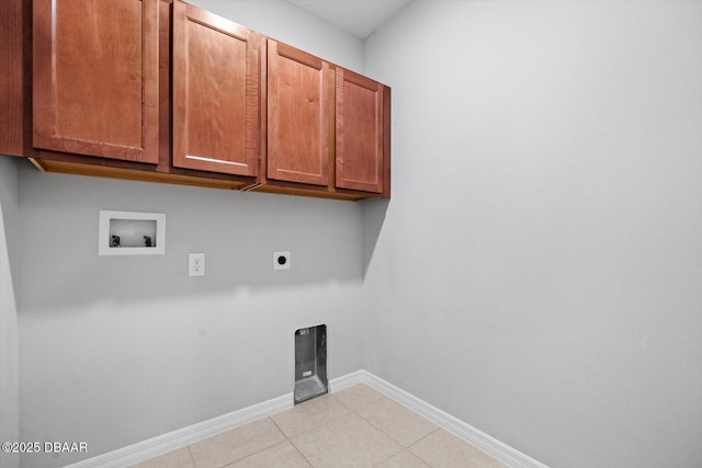 laundry area featuring light tile patterned flooring, cabinets, hookup for a washing machine, and electric dryer hookup