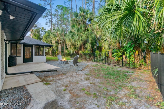 view of yard with a patio and a fire pit