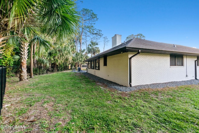 view of property exterior featuring a lawn