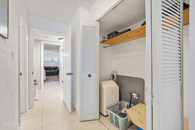 washroom featuring light tile patterned flooring