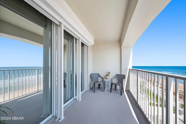 balcony with a view of the beach and a water view