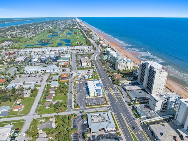 bird's eye view featuring a beach view and a water view