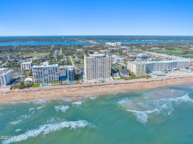 bird's eye view featuring a beach view and a water view