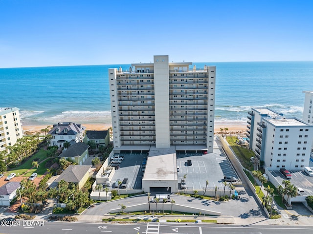 birds eye view of property featuring a view of the beach and a water view