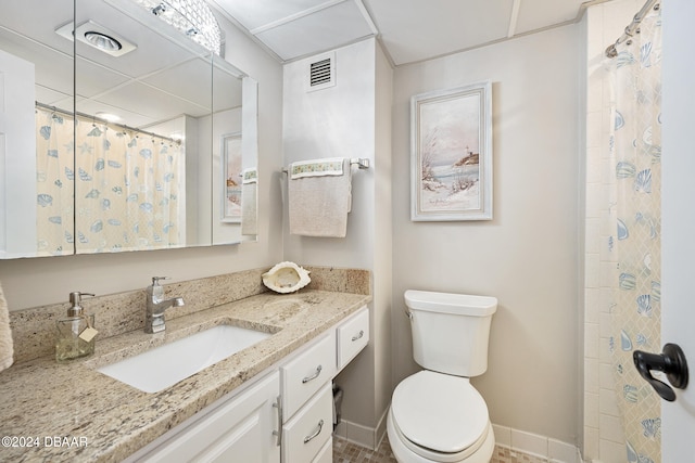 bathroom with vanity, toilet, and a shower with shower curtain