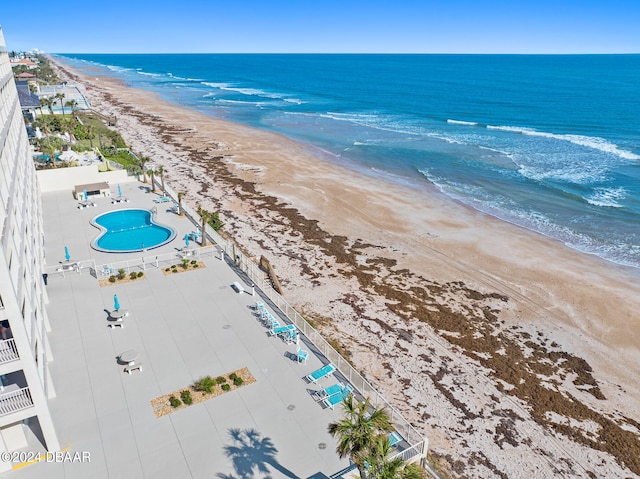 aerial view featuring a view of the beach and a water view