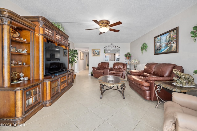 tiled living room featuring a textured ceiling and ceiling fan