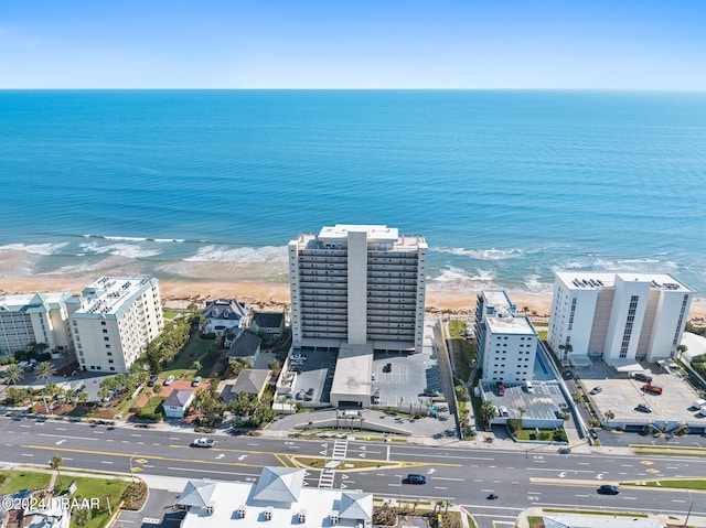 bird's eye view with a view of the beach and a water view