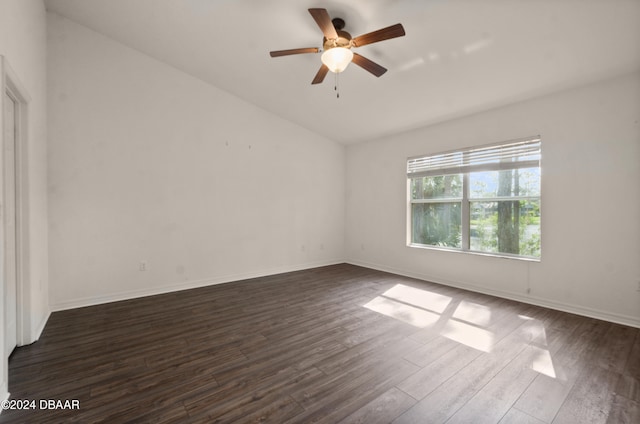 empty room featuring ceiling fan and dark wood-type flooring