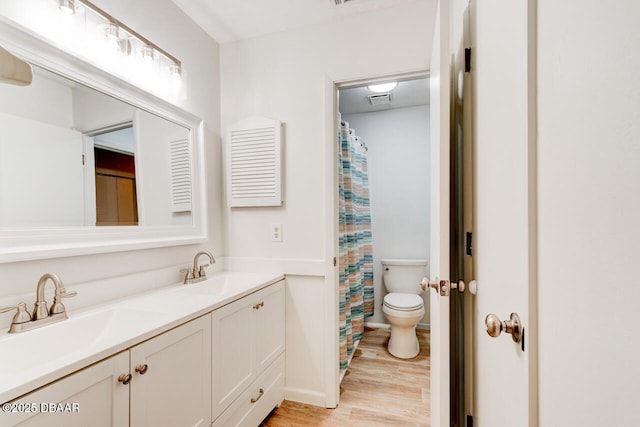 5 Park Pl, Ormond Beach, FL 32174 - full bathroom with wood finished floors, double vanity, and curtained shower