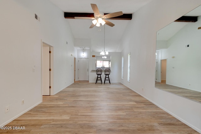 5 Park Pl, Ormond Beach, FL 32174 - living area featuring beam ceiling, high vaulted ceiling, a ceiling fan, and light wood-type flooring