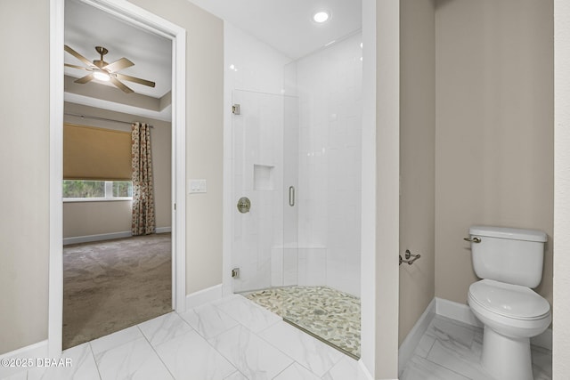 bathroom featuring ceiling fan, walk in shower, and toilet