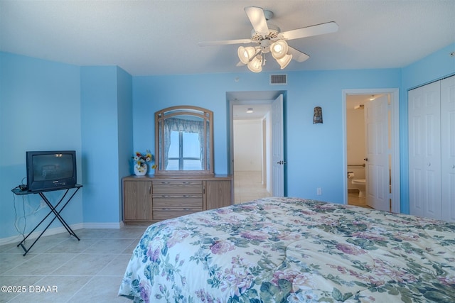 bedroom featuring light tile patterned floors, a closet, visible vents, a ceiling fan, and baseboards