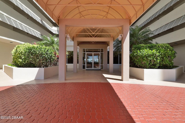 entrance to property featuring french doors