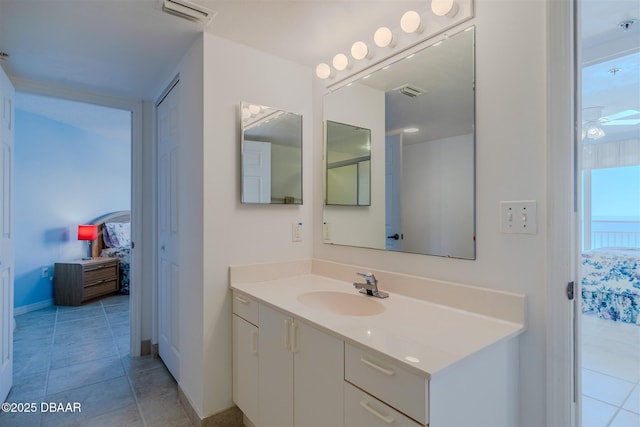 bathroom featuring vanity, tile patterned flooring, and visible vents