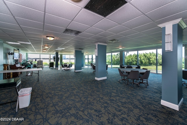 gym featuring a paneled ceiling and carpet floors