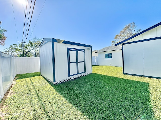 view of outbuilding with a lawn