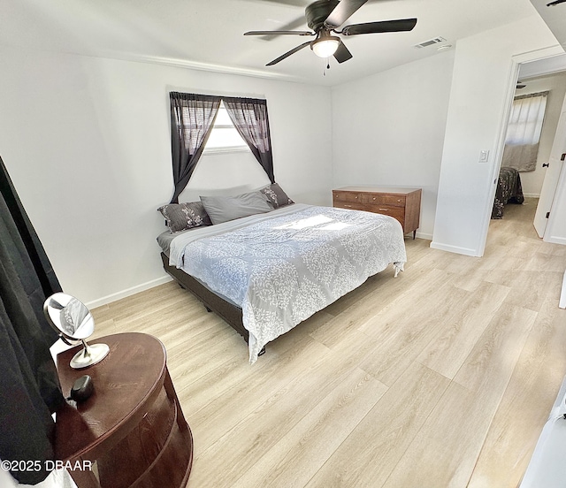 bedroom featuring ceiling fan and light hardwood / wood-style floors