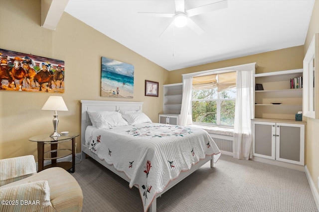 carpeted bedroom with ceiling fan and lofted ceiling