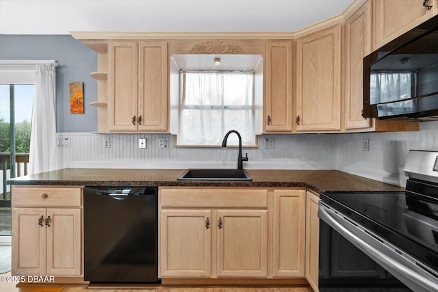 kitchen with light brown cabinetry, sink, and black appliances