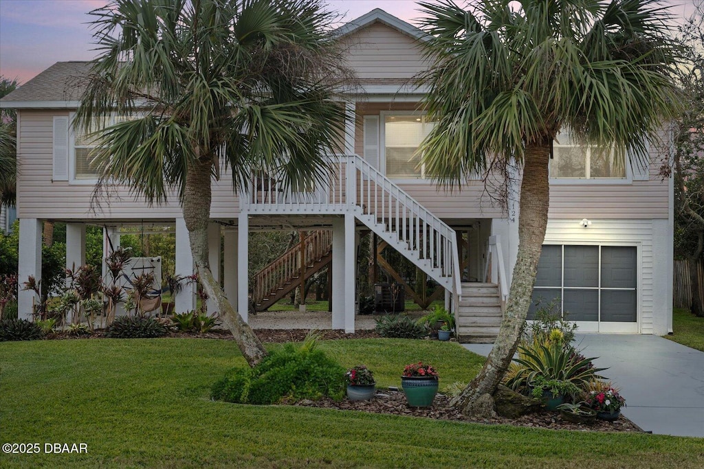 exterior space featuring a garage and a yard