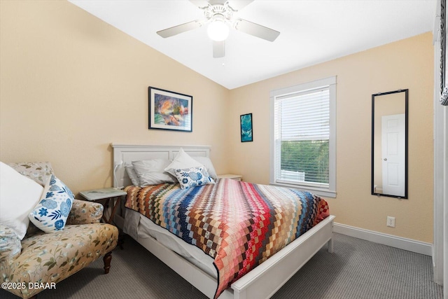 carpeted bedroom with ceiling fan and vaulted ceiling