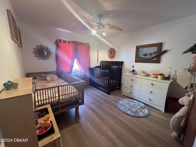 bedroom featuring hardwood / wood-style flooring and ceiling fan