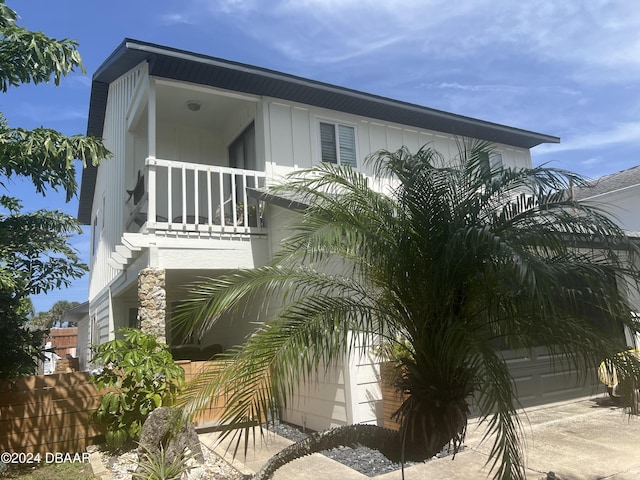 view of front of house with a balcony and a garage