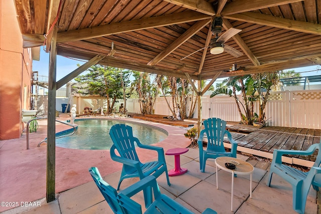 view of patio / terrace featuring a gazebo and a swimming pool side deck