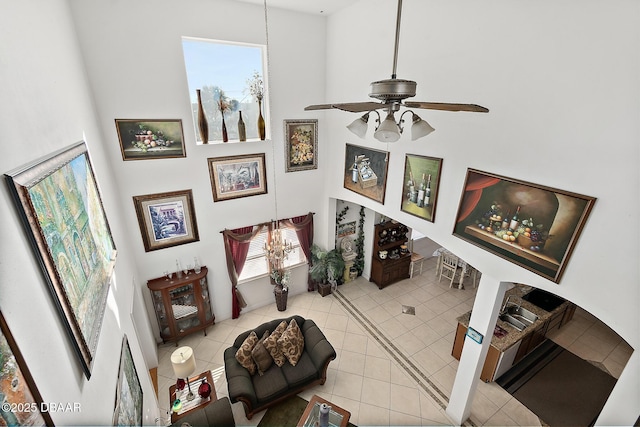 tiled living room featuring ceiling fan