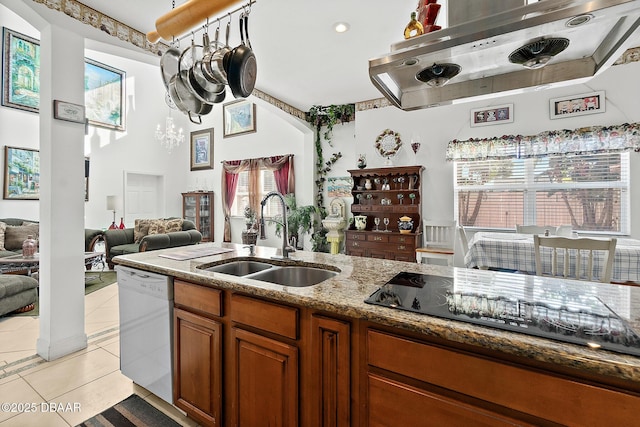 kitchen with sink, exhaust hood, light tile patterned floors, white dishwasher, and black electric cooktop