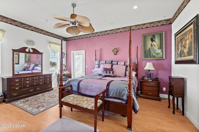 bedroom featuring crown molding, ceiling fan, and light hardwood / wood-style flooring