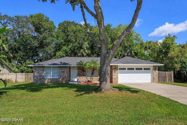 ranch-style home with a garage and a front yard