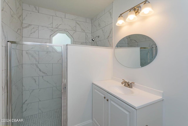 bathroom with vanity and a shower with door