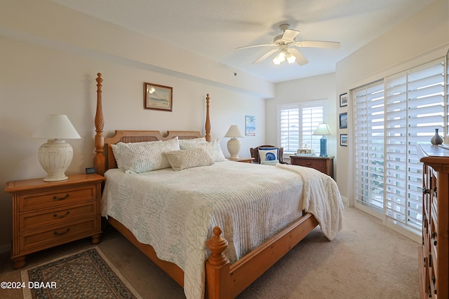 carpeted bedroom featuring access to outside and ceiling fan