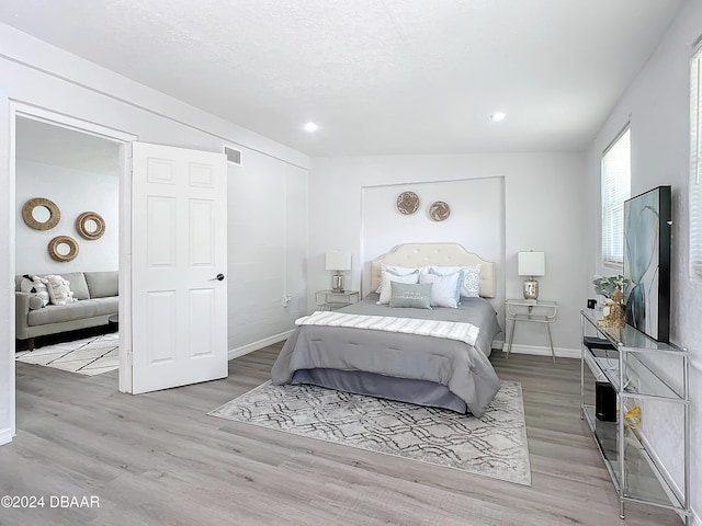 bedroom featuring light wood-type flooring