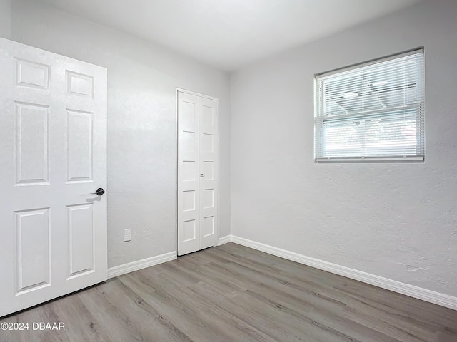 unfurnished bedroom featuring light hardwood / wood-style floors