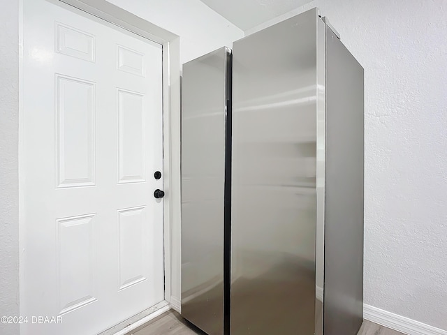 bathroom with hardwood / wood-style floors